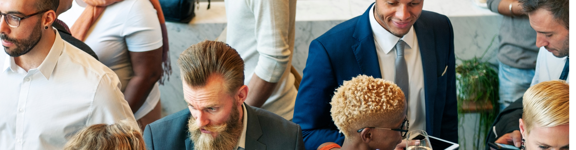 Professionals at a networking event discussing nonprofit board service and governance.